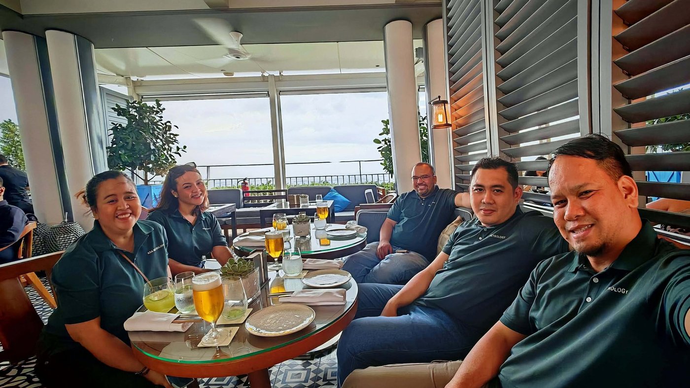 The KSA Metrology Pte Ltd team relaxing together over a meal